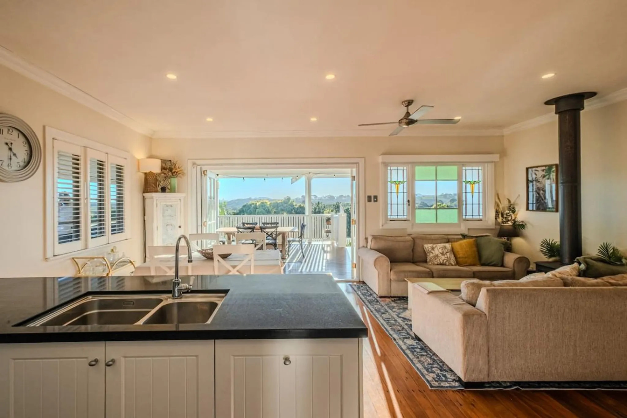 Interior view of a modern living room and dining area with a view of the outdoors.