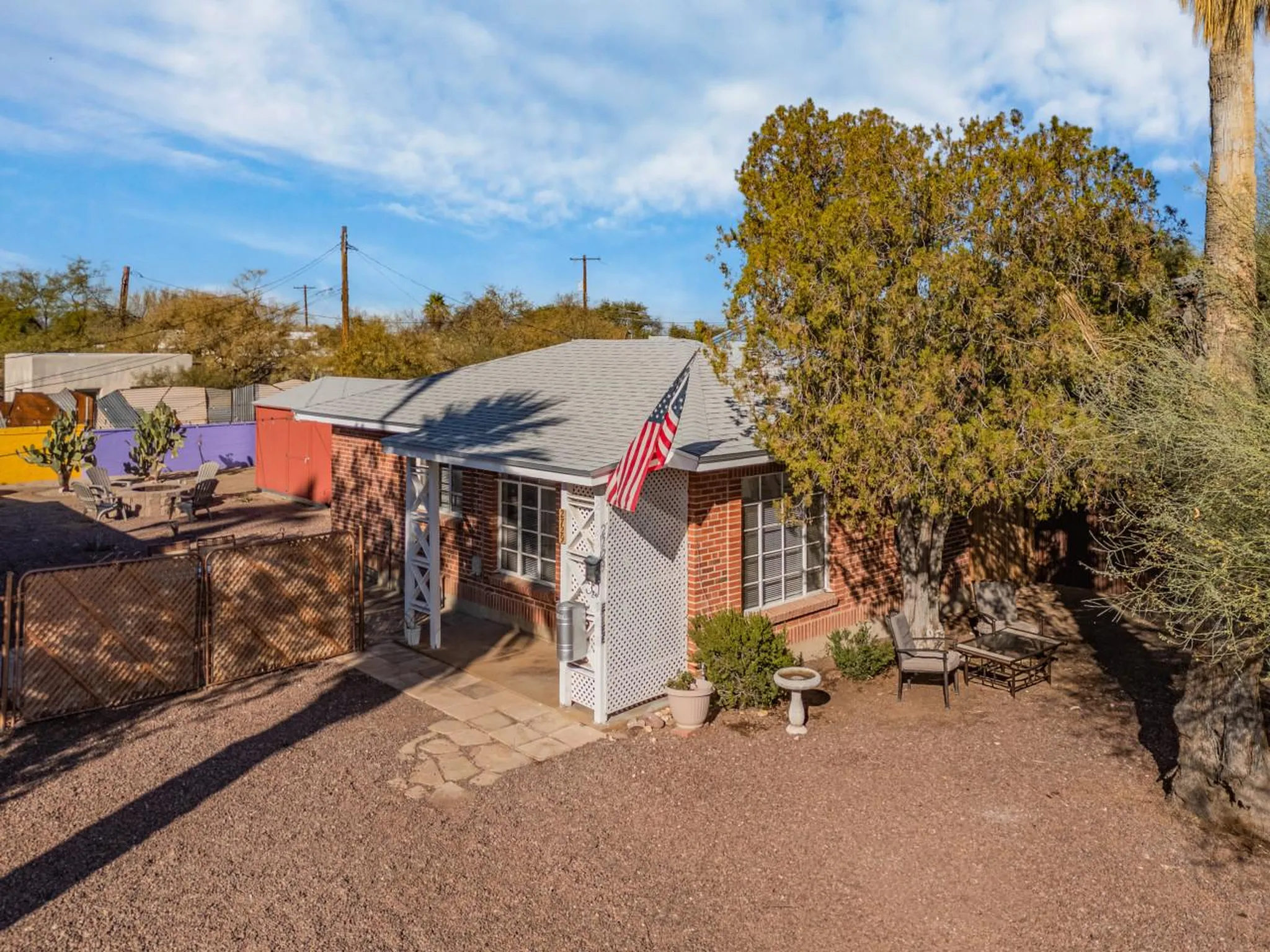 A charming brick house with an American flag flying proudly.