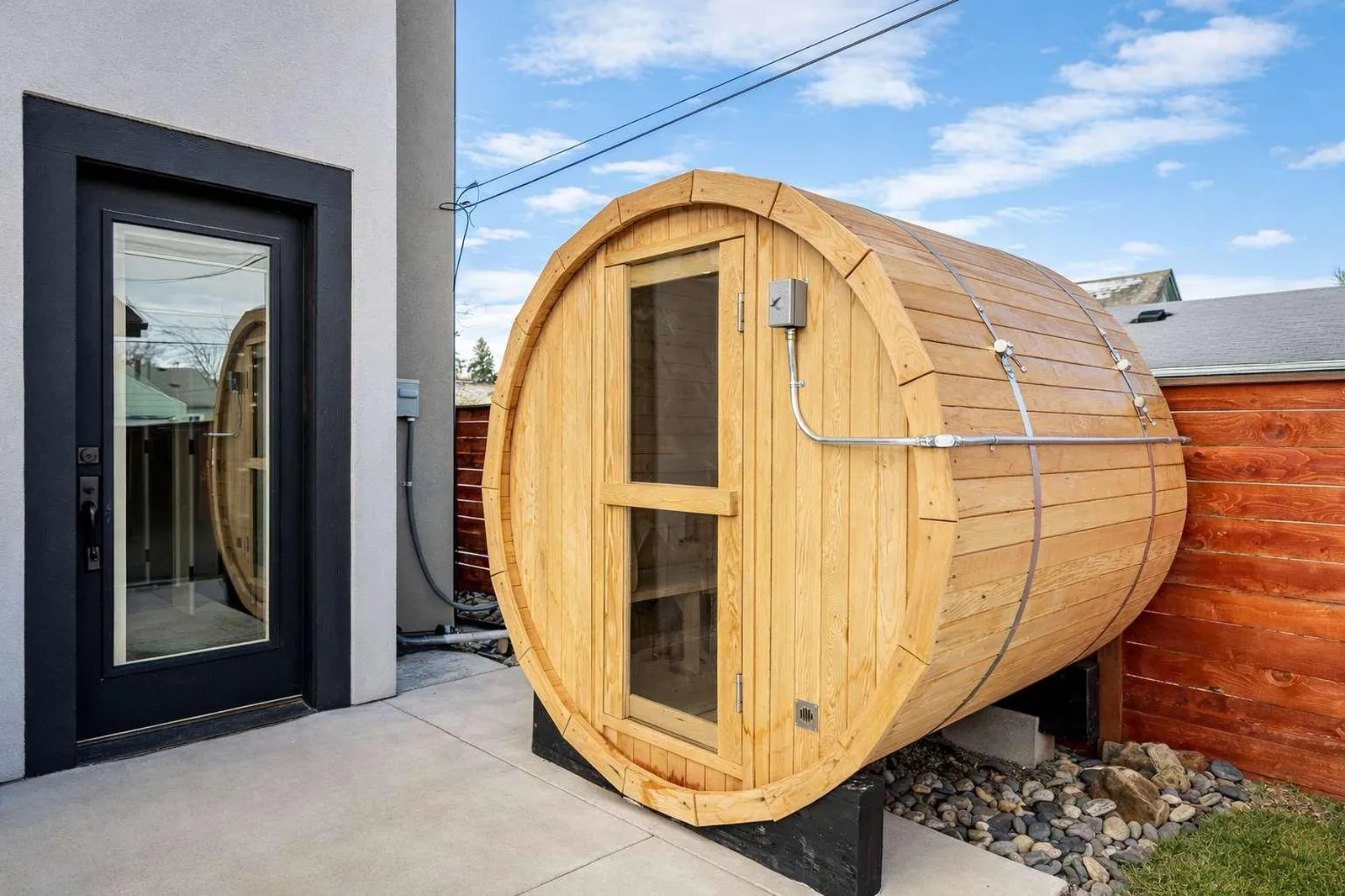 Private electric Canadian Hemlock barrel sauna in the backyard at The Zen Den