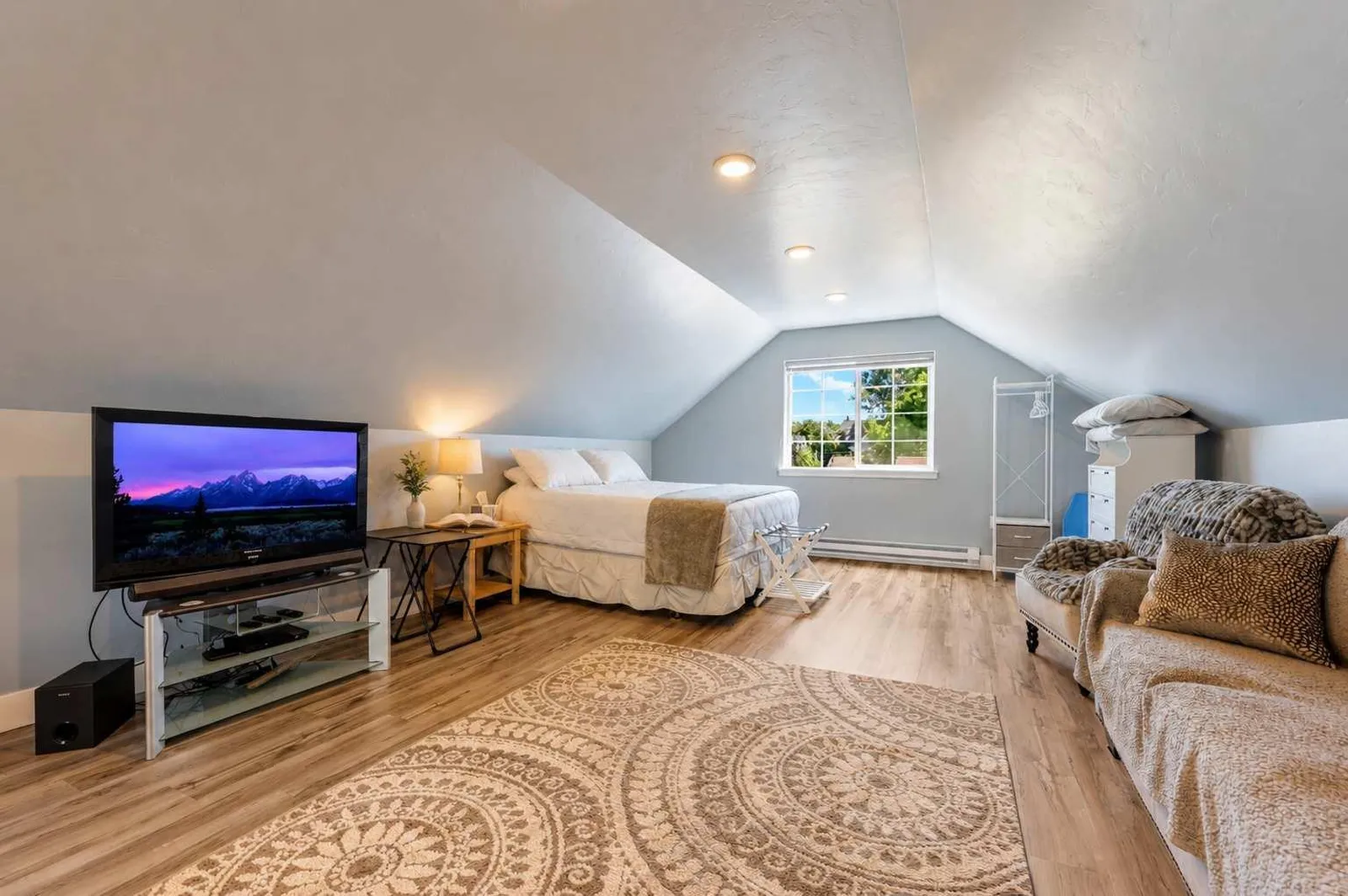 The Carriage Loft king bedroom with vaulted ceilings in Sheridan Wyoming vacation rental
