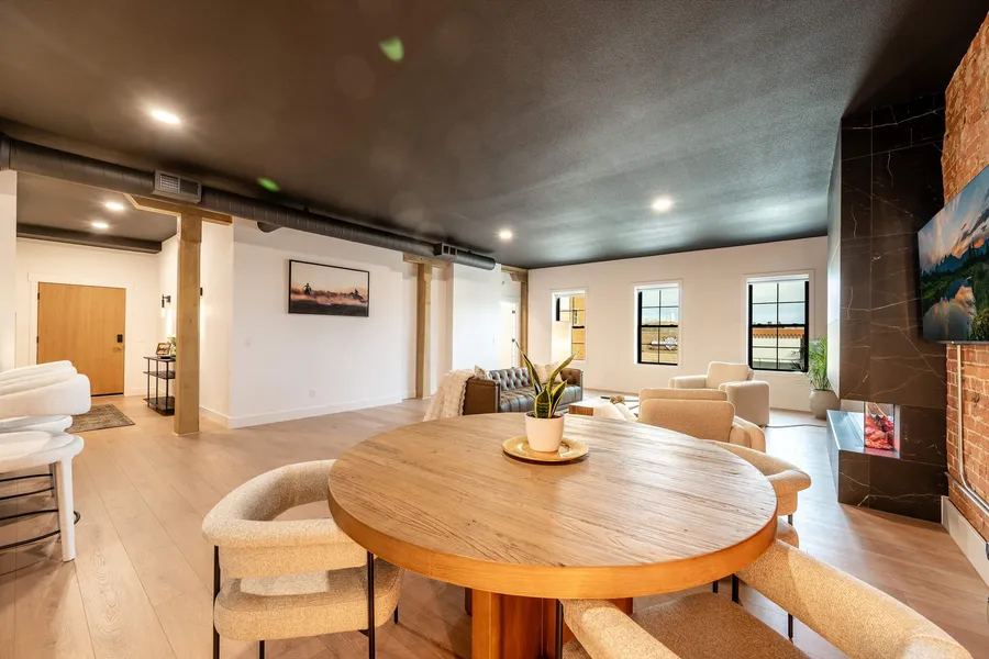 Dining table under exposed brick at The Onyx, downtown Sheridan