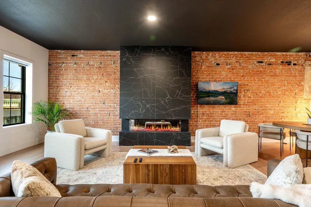 Living room with two fireplaces at The Onyx, downtown Sheridan