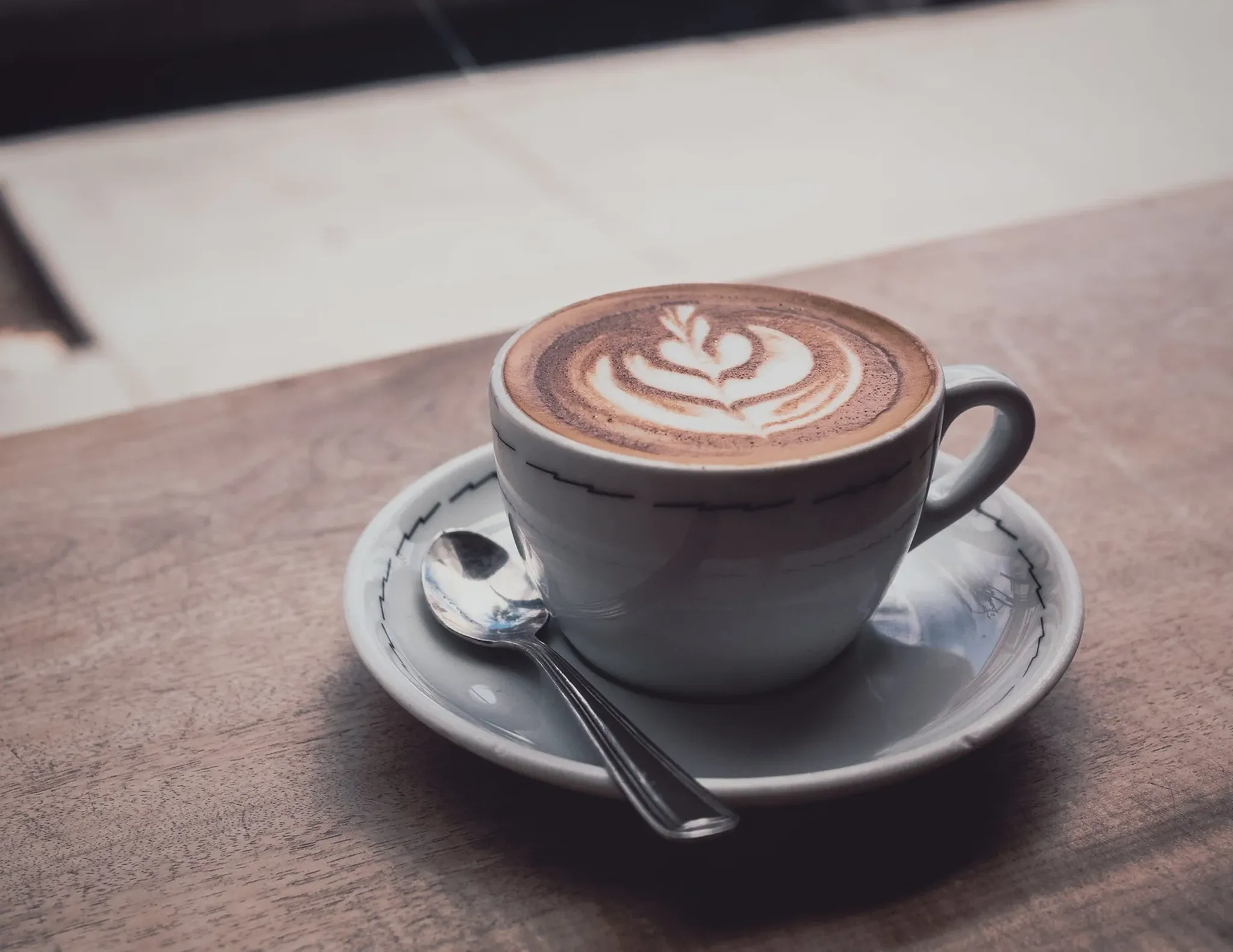 A cappuccino on a windowsill in a Pittsburgh coffee shop