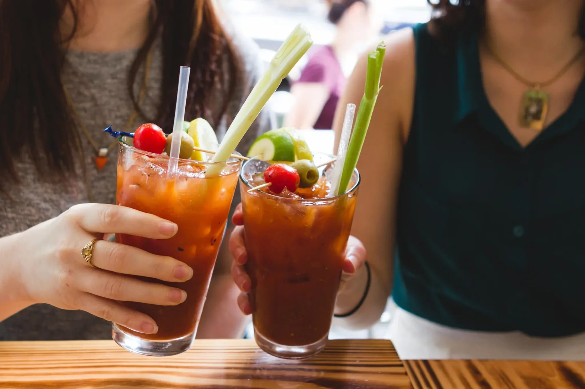 A bloody mary and brunch spread on a restaurant table