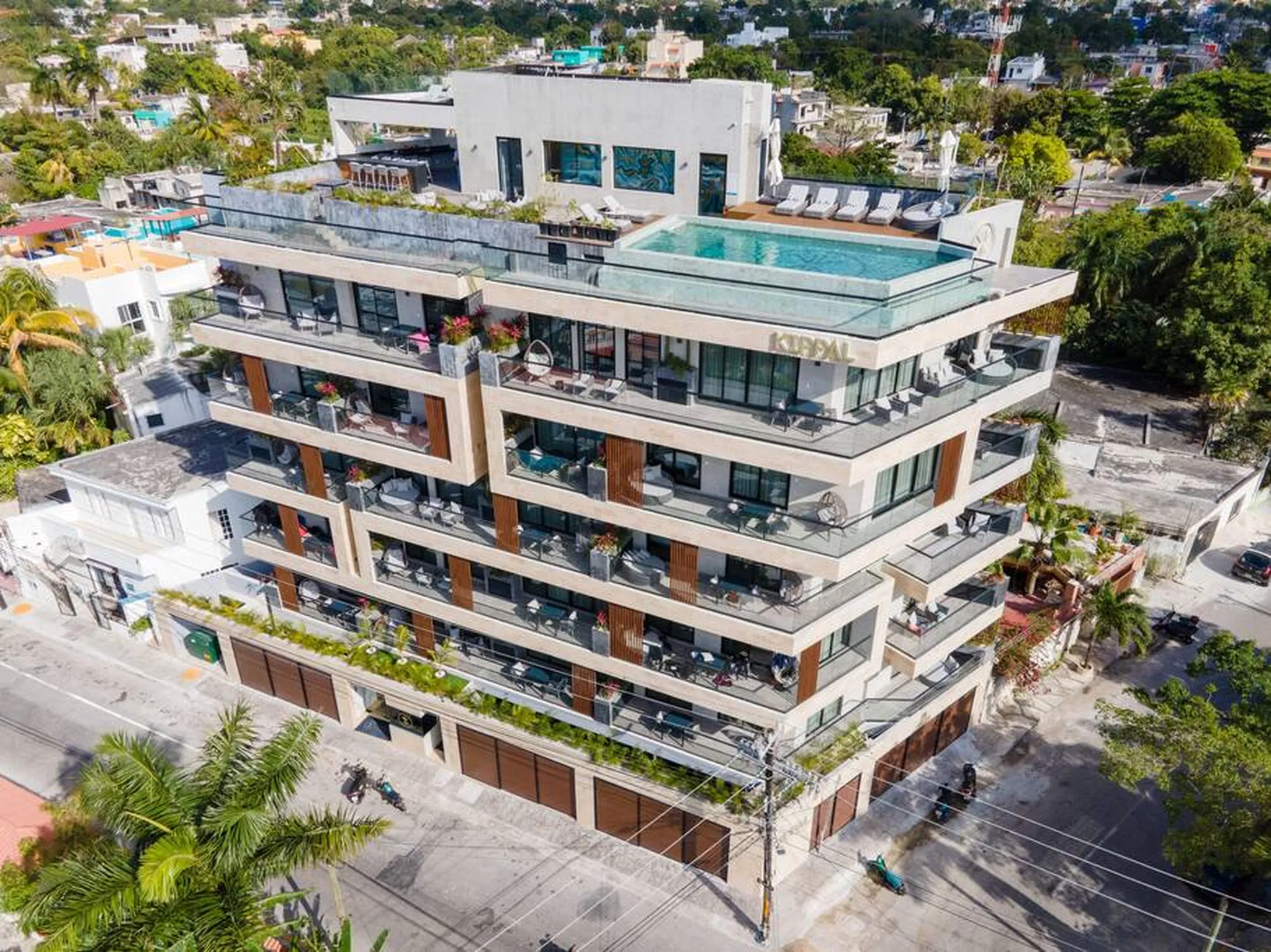Aerial view of the Kippal Cozumel building on 10a Avenida Sur, rooftop pool and balconies