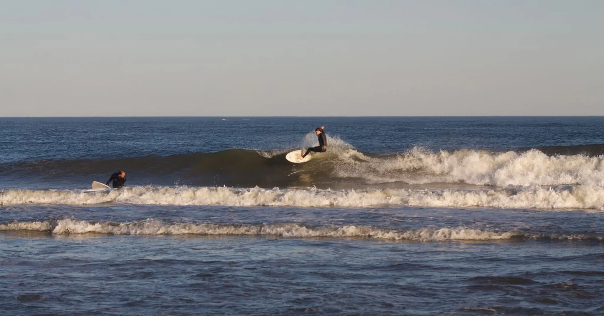 Surfing New Smyrna Beach in 2026: Best Breaks, Season Timing & Surf-Ready Condos