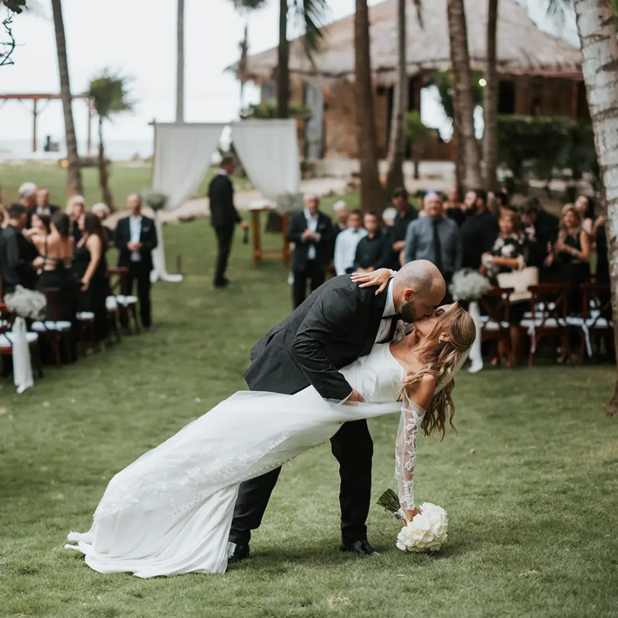 Couple celebrating a luxury garden wedding ceremony at a private villa in Riviera Maya