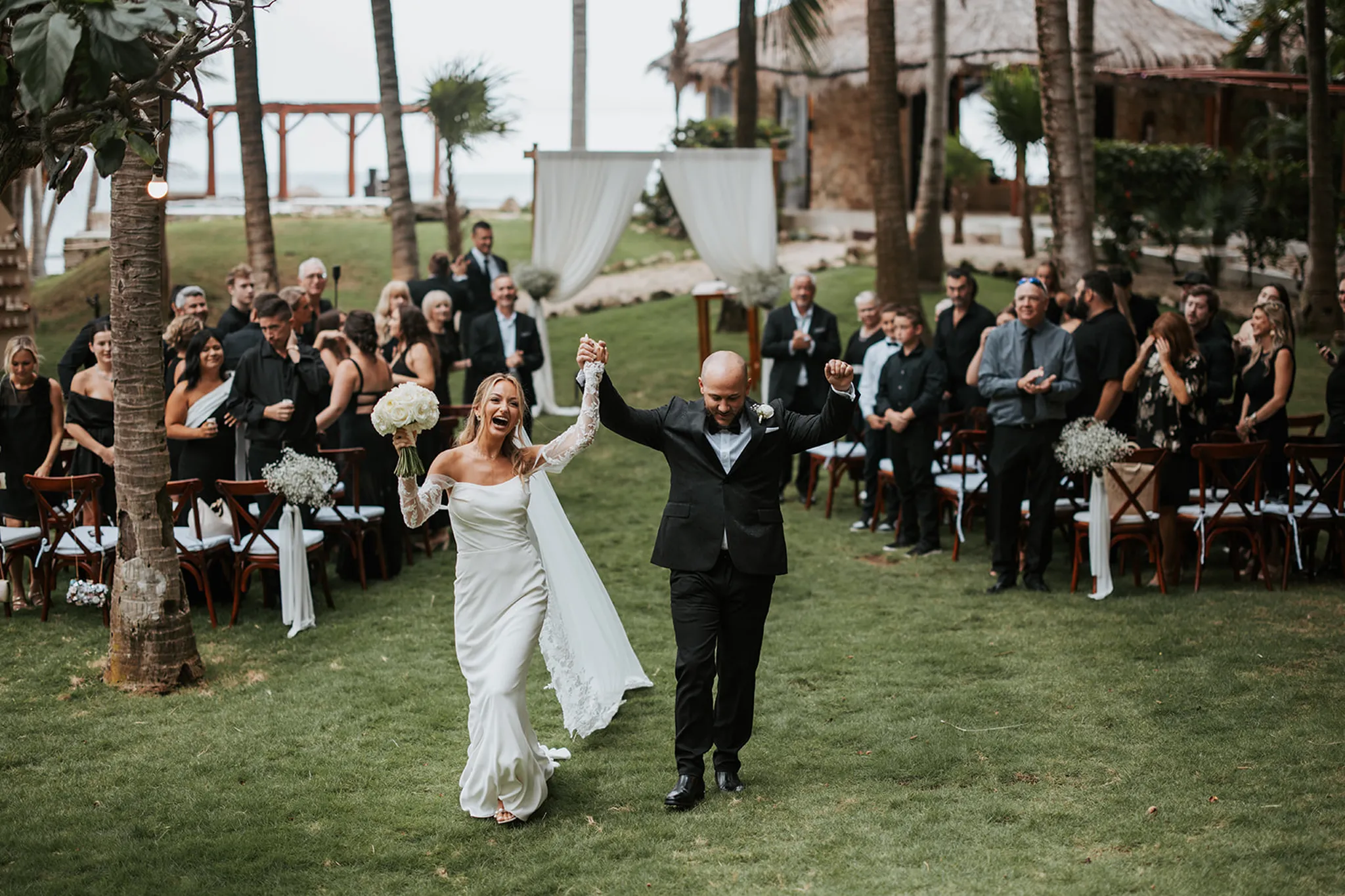 Couple celebrating after wedding ceremony in luxury villa garden at the Riviera Maya
