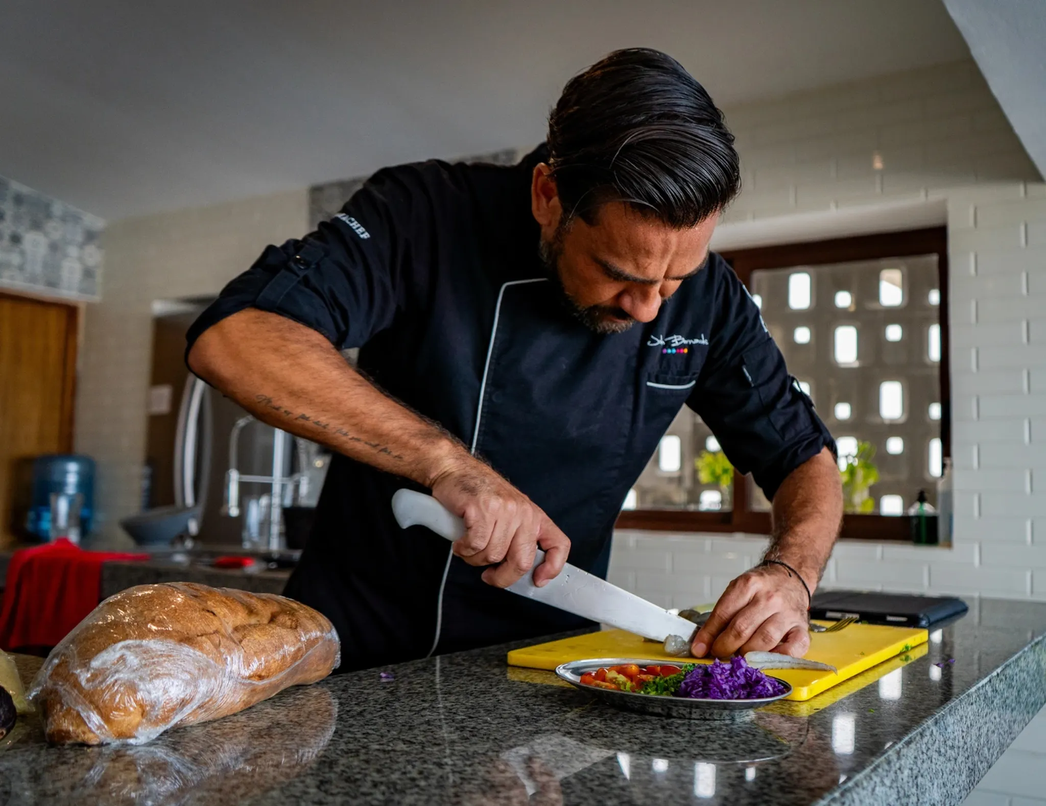 Private chef cooking fresh meals inside a luxury villa in the Riviera Maya