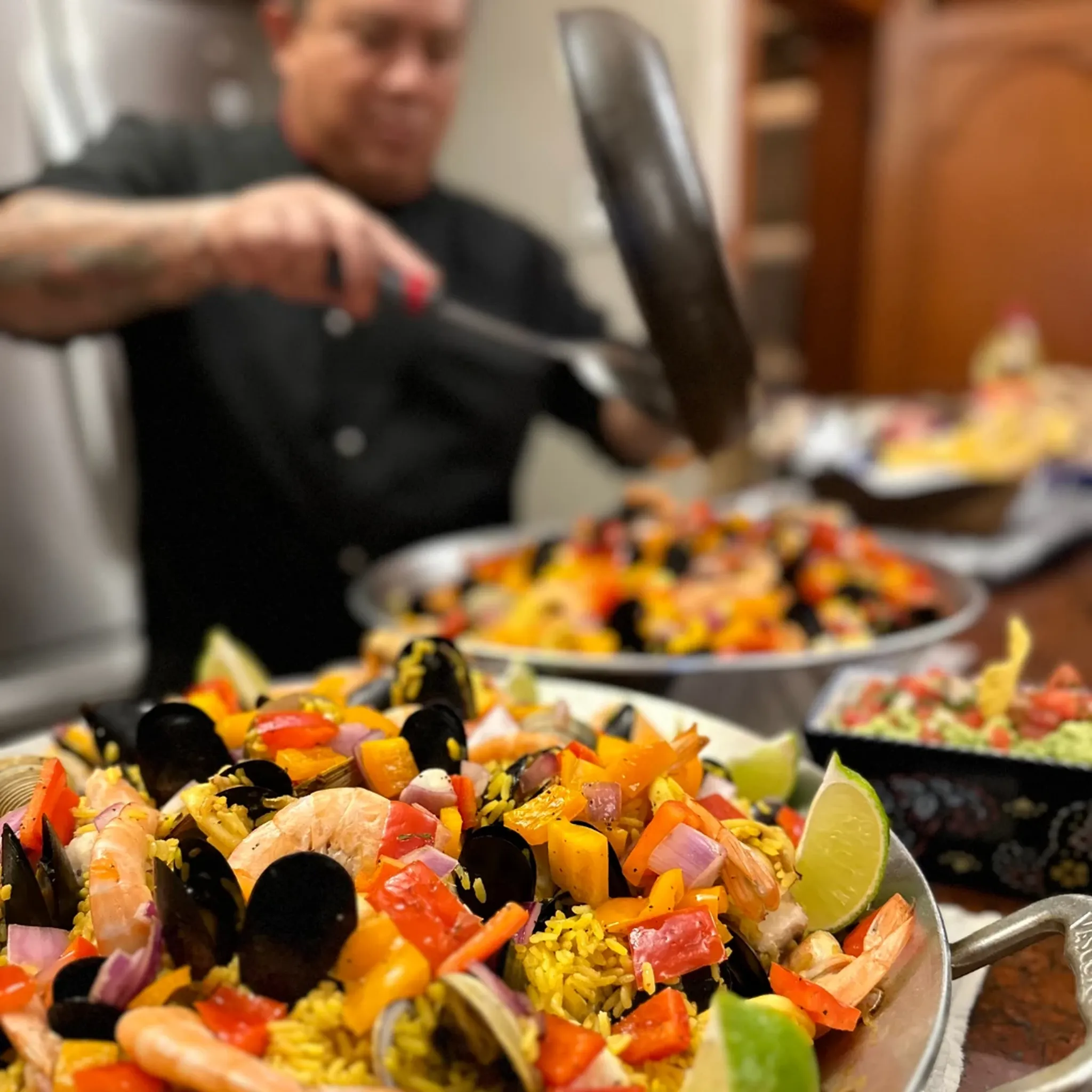 Private chef preparing seafood paella in a luxury villa in Riviera Maya