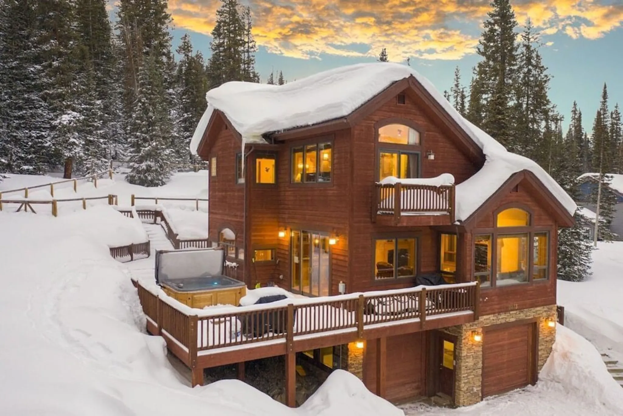 Alpine Vista, a Luxe Living home in Breckenridge, with its hot tub deck in the snow
