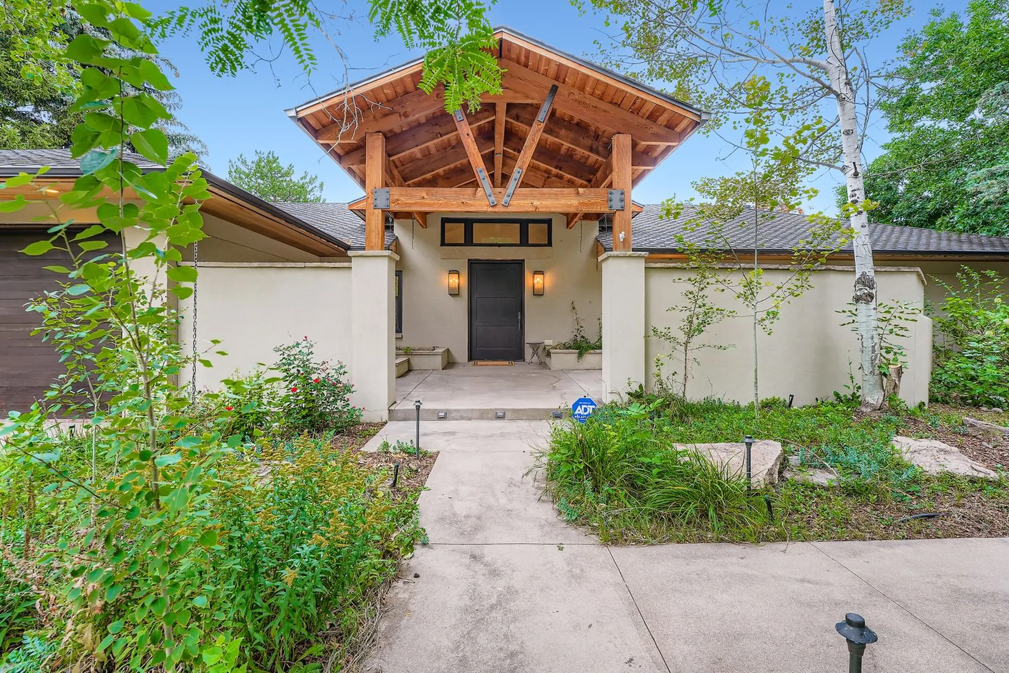 Timber-framed entry of The Luxe at Rolling Hills, a Luxe Living home in Golden, Colorado