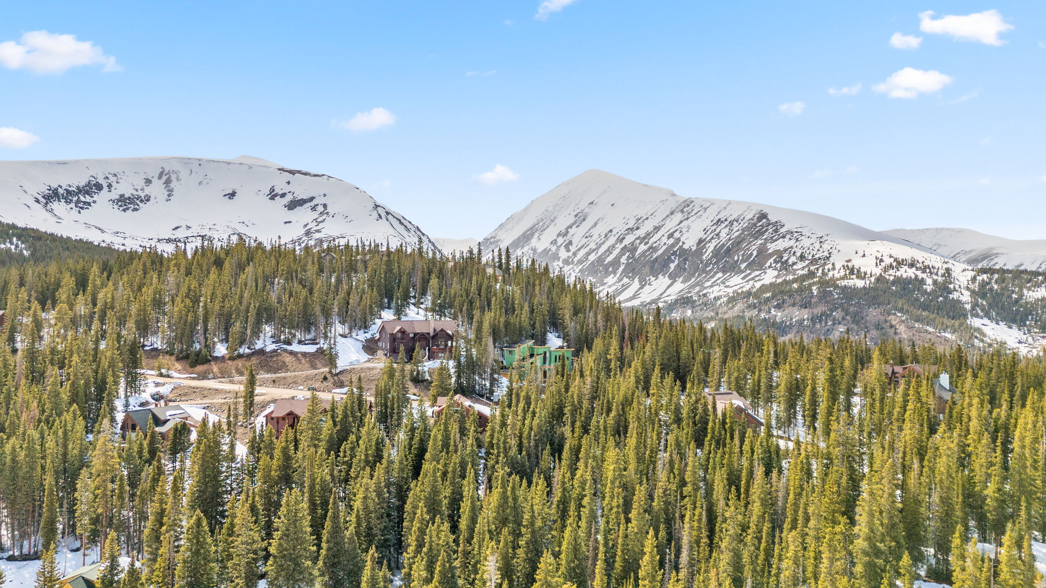 Breckenridge homes among the pines below the snow-capped Tenmile Range, from the Carroll Lane Escape listing