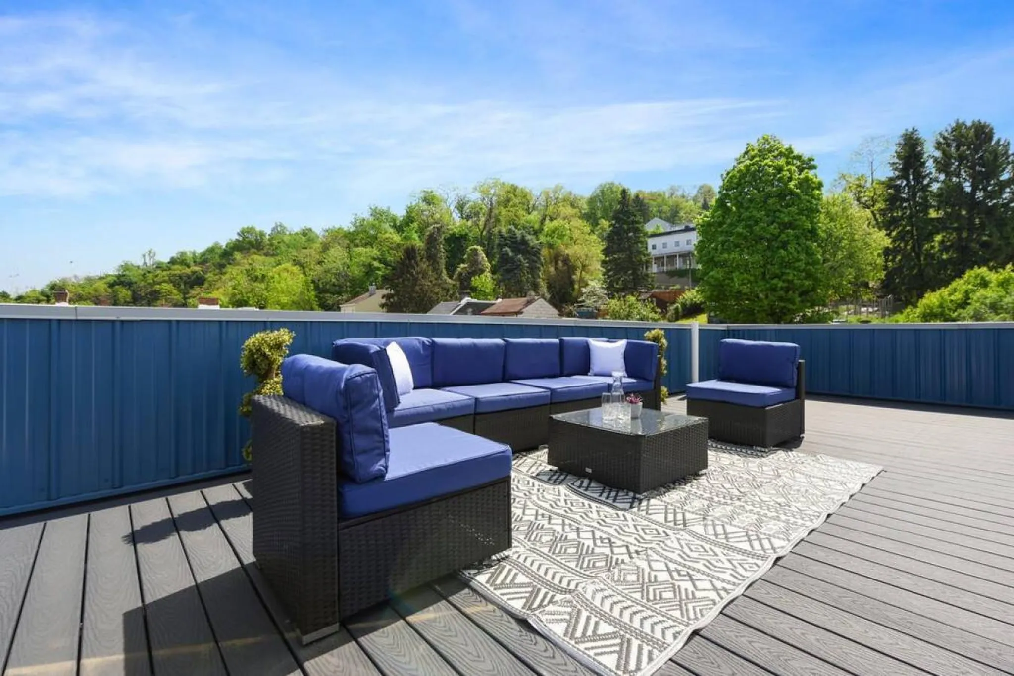 Rooftop deck with sectional seating at a HostWise group home