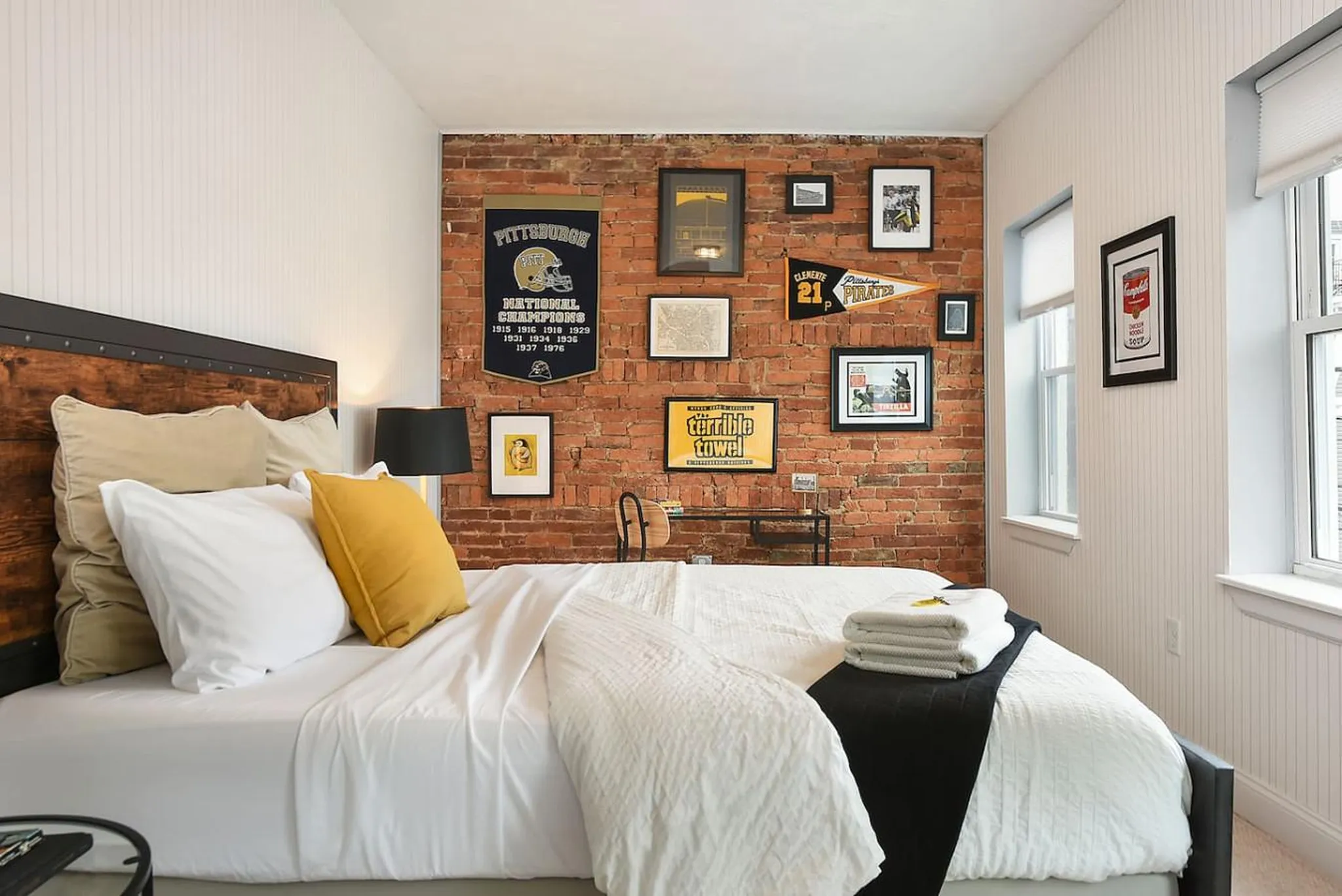 Bedroom with Pittsburgh pennants in a walkable Lawrenceville home
