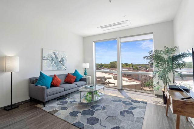 1BR City Loft With Modern Glass Views