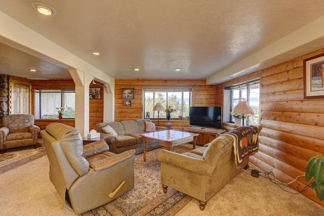 Panorama | Sweeping Bighorn Mountain Views | Spacious 3-Bedroom Walk-Out Retreat | Renovated Spa Bathroom | Western Living Room with Log Accents | Sheridan Wyoming Vacation Rental