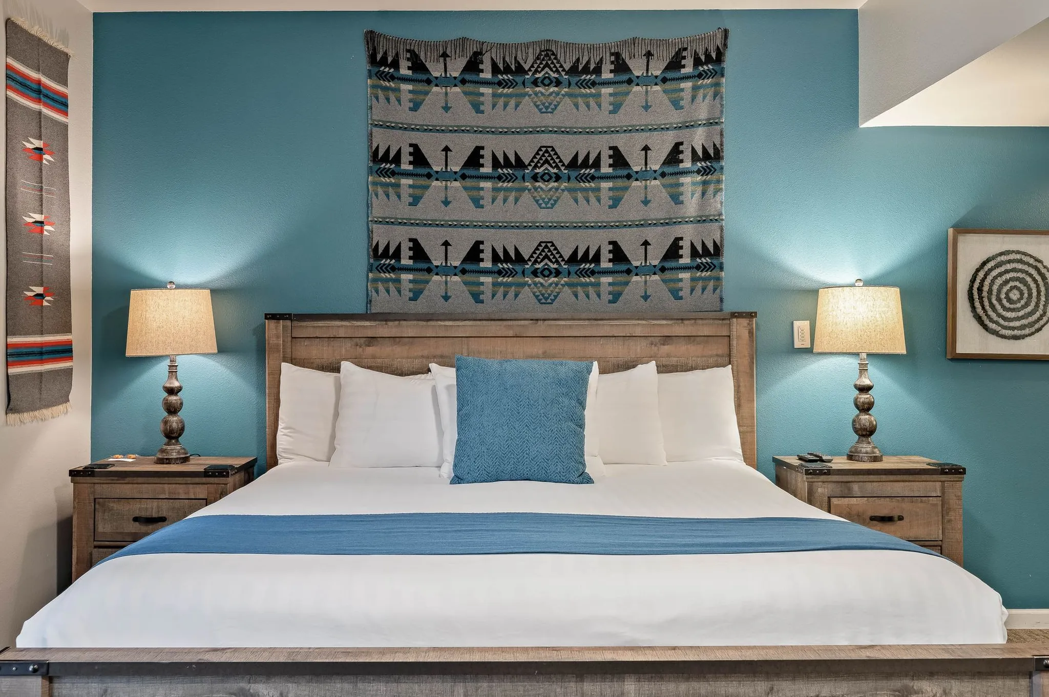 bed shown with blue accent wall behind