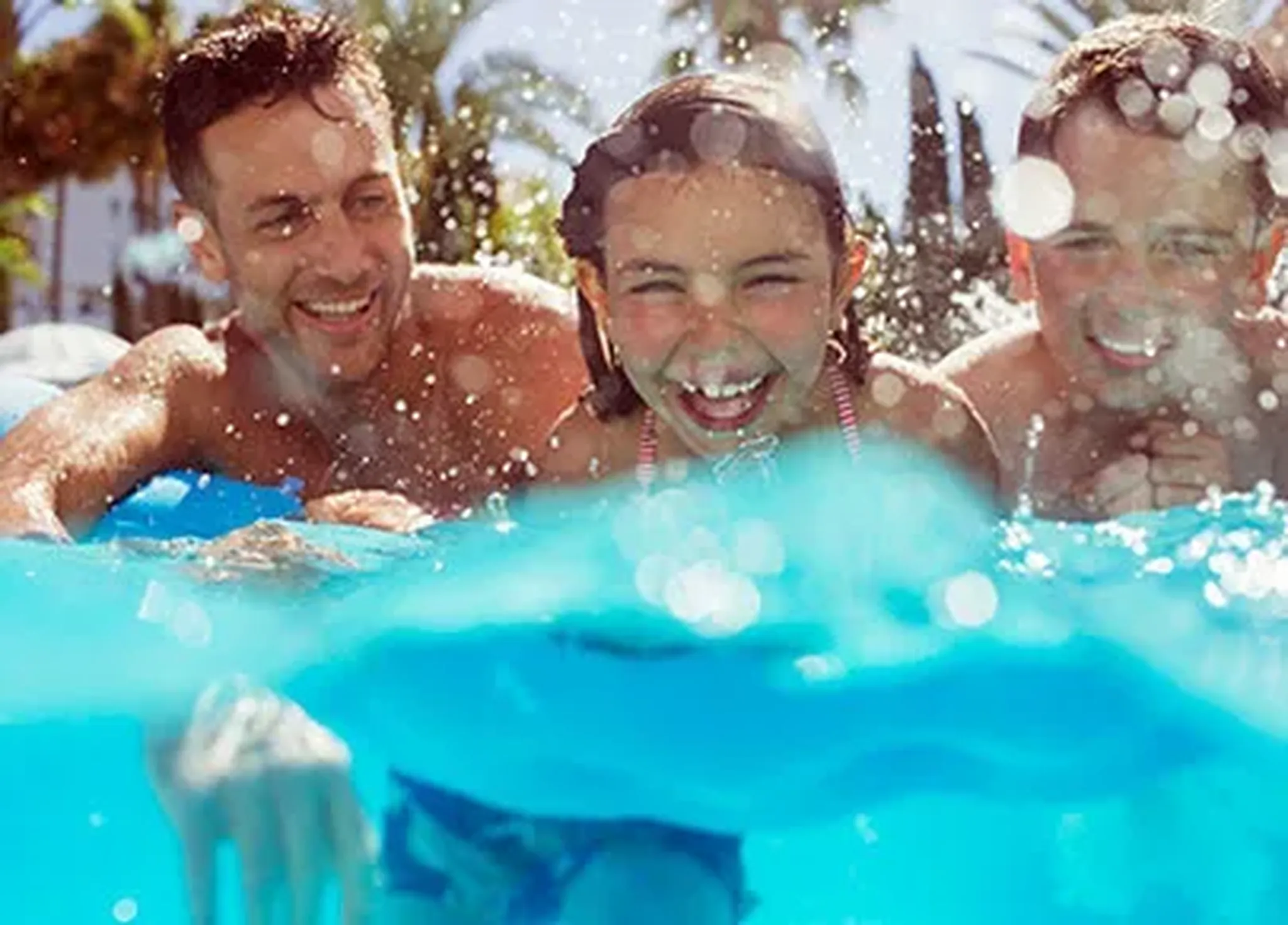 Families relaxing in the pool at Runaway Bay Condominiums on Anna Maria Island