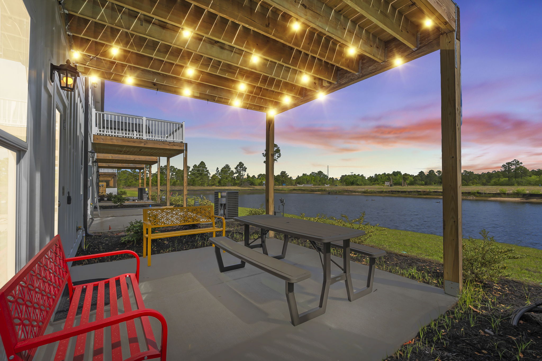 Lakefront patio pergola at sunset