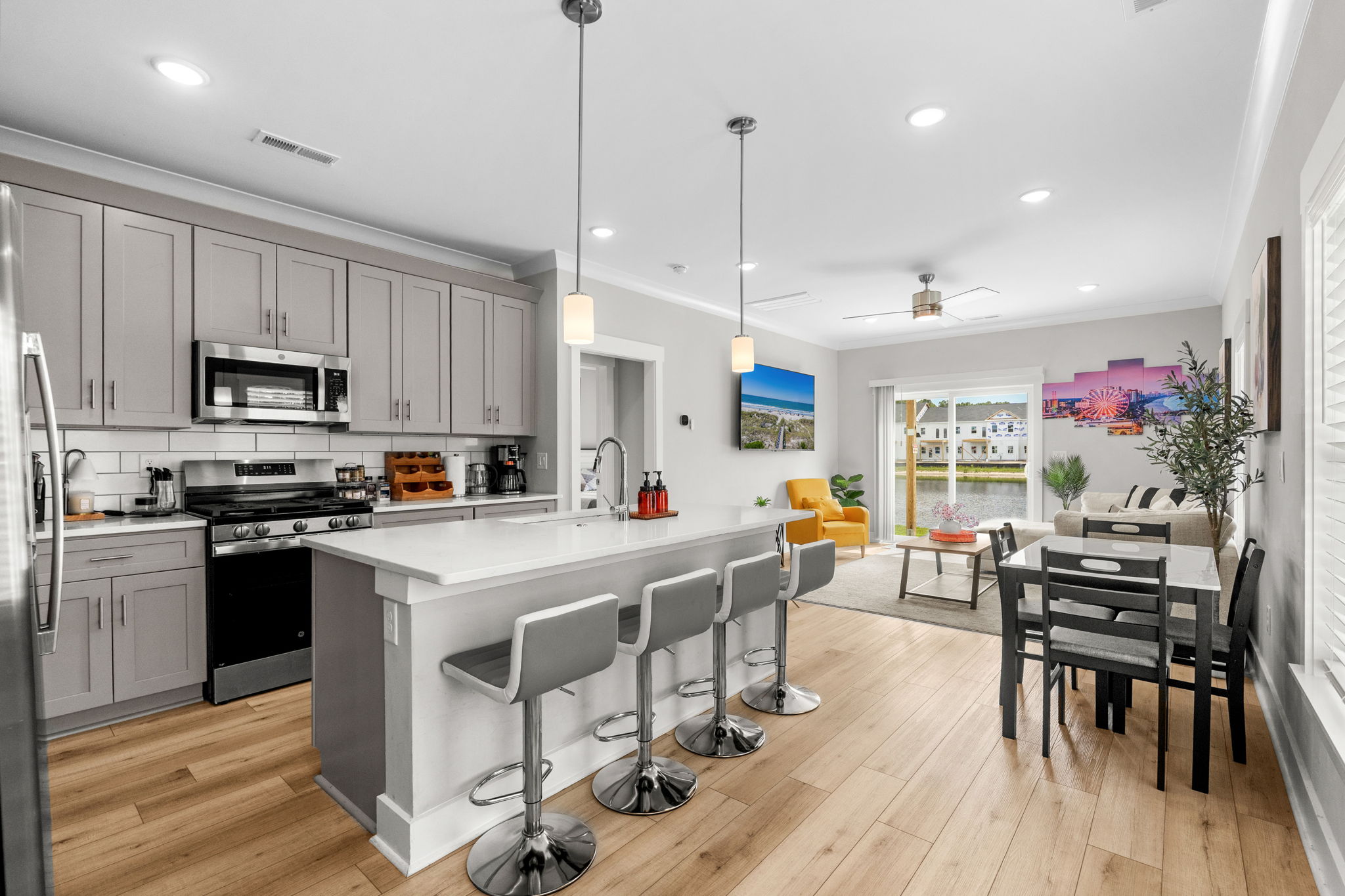 White kitchen and dining table set for the whole group