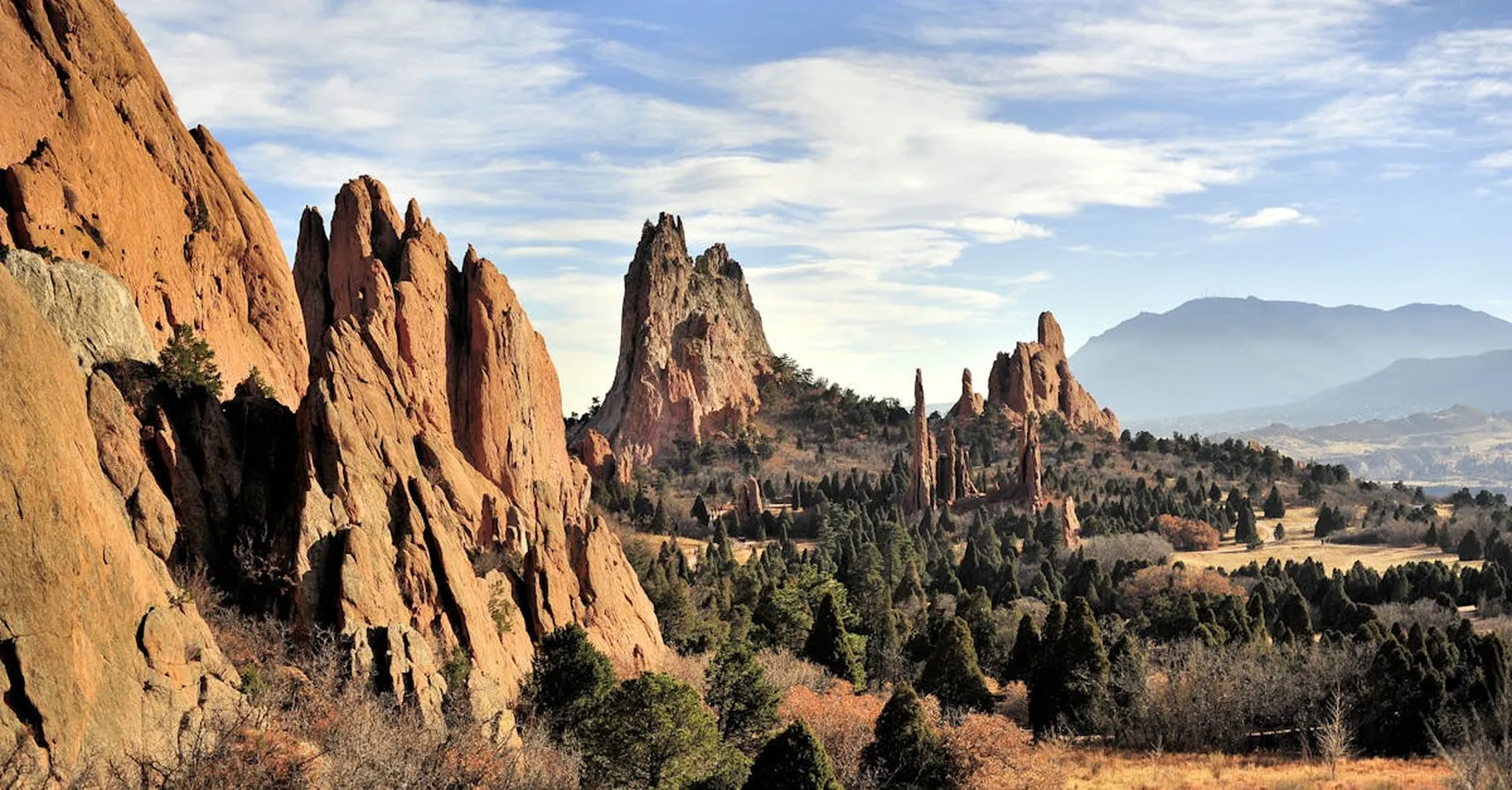 Dramatic red rock formations at Garden of the Gods, Colorado Springs under a bright blue sky.