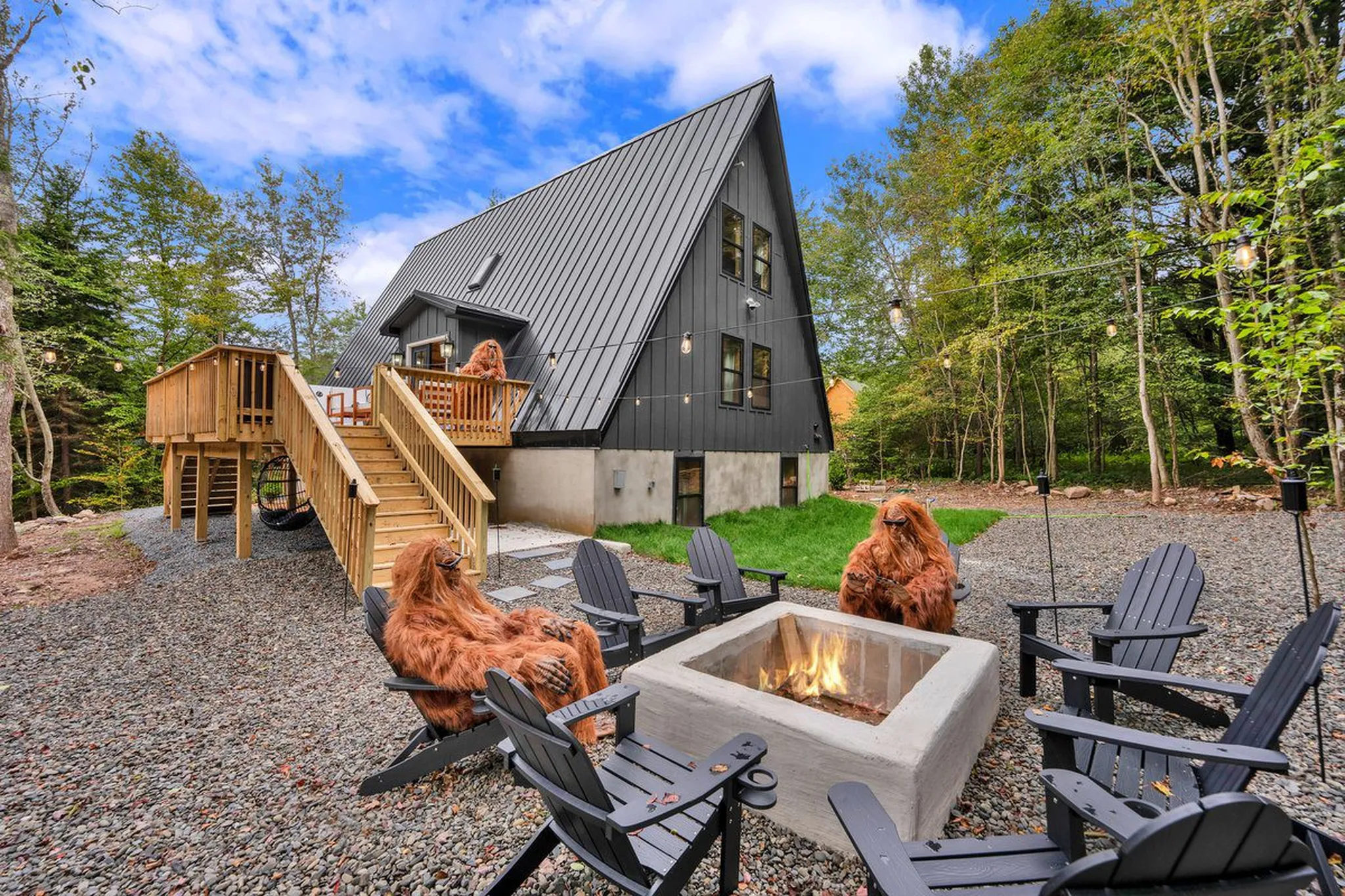 Luxury cabin rental in Poconos with fire pit and fun Sasquatch figures