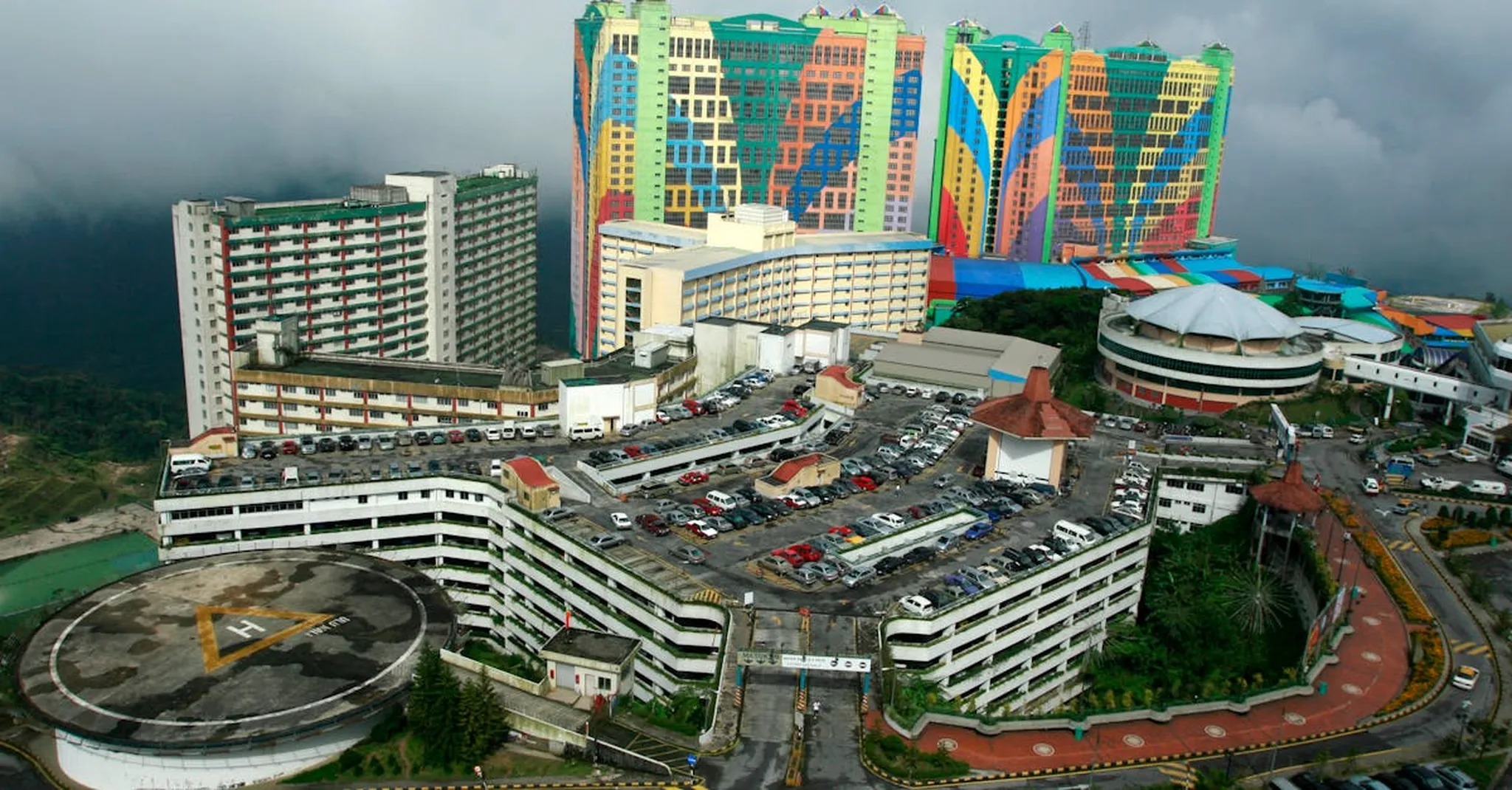 Aerial view of the colorful First World Hotel, a landmark in Malaysia's Genting Highlands.