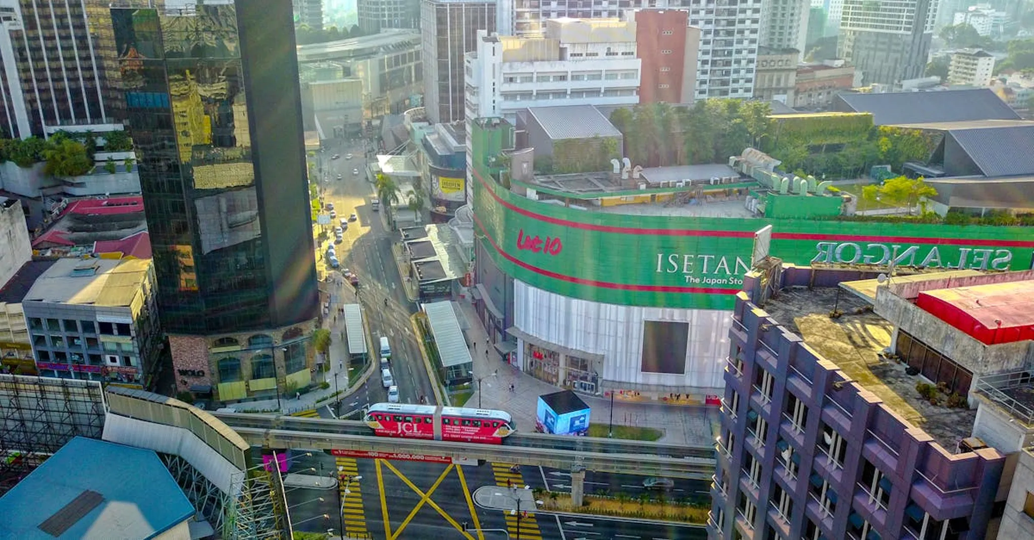 Aerial shot of Kuala Lumpur's vibrant Bukit Bintang area featuring busy streets and iconic buildings.