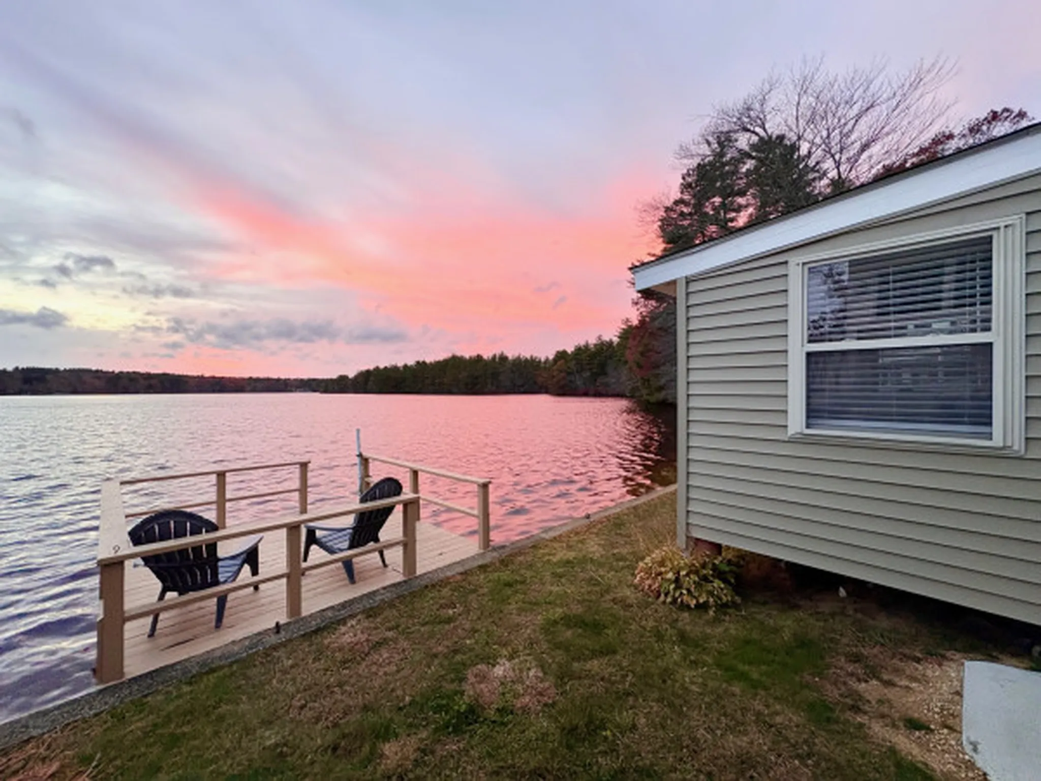 Tranquil sandy beach with coastal house, perfect for summer seaside retreats.