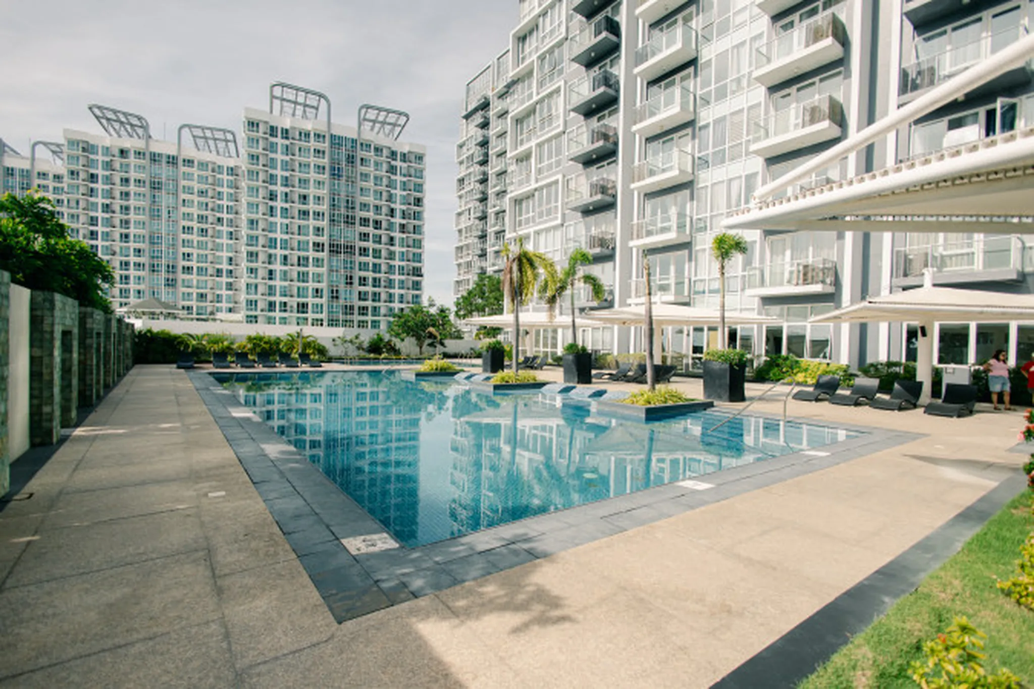 Atmospheric architectural backdrop suitable for an overlay text headline — exterior or wide interior context, late-day soft light, no people, no signs, no transactional or real-estate imagery. Geograp