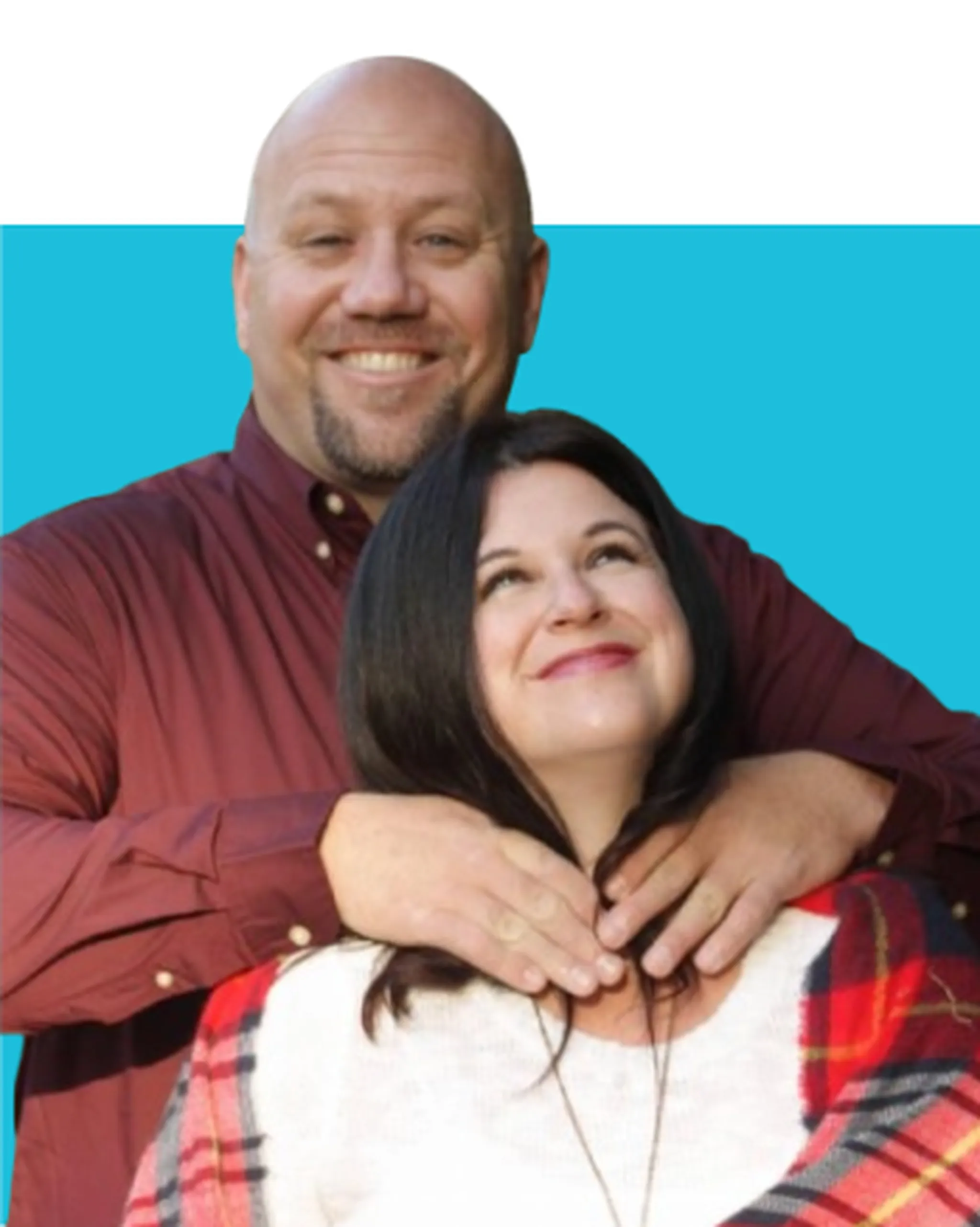 Mike standing behind Brittany, both smiling